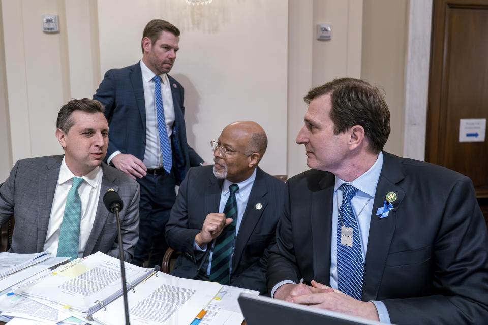 Democratic members of the House Homeland Security Committee, from left, Rep. Seth Magaziner, D-R.I., Rep. Eric Swalwell, D-Calif., Rep. Glenn Ivey, D-Md., and Rep. Dan Goldman, D-N.Y., meet during a break as Republicans move to impeach Secretary of Homeland Security Alejandro Mayorkas over the crisis at the U.S.-Mexico border, at the Capitol in Washington, Tuesday, Jan. 30, 2024. (AP Photo/J. Scott Applewhite)