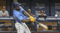 Tampa Bay Rays' Randy Arozarena hits a three-run home run off Baltimore Orioles starter Jordan Lyles during the third inning of a baseball game Sunday, Aug. 14, 2022, in St. Petersburg, Fla. (AP Photo/Steve Nesius)