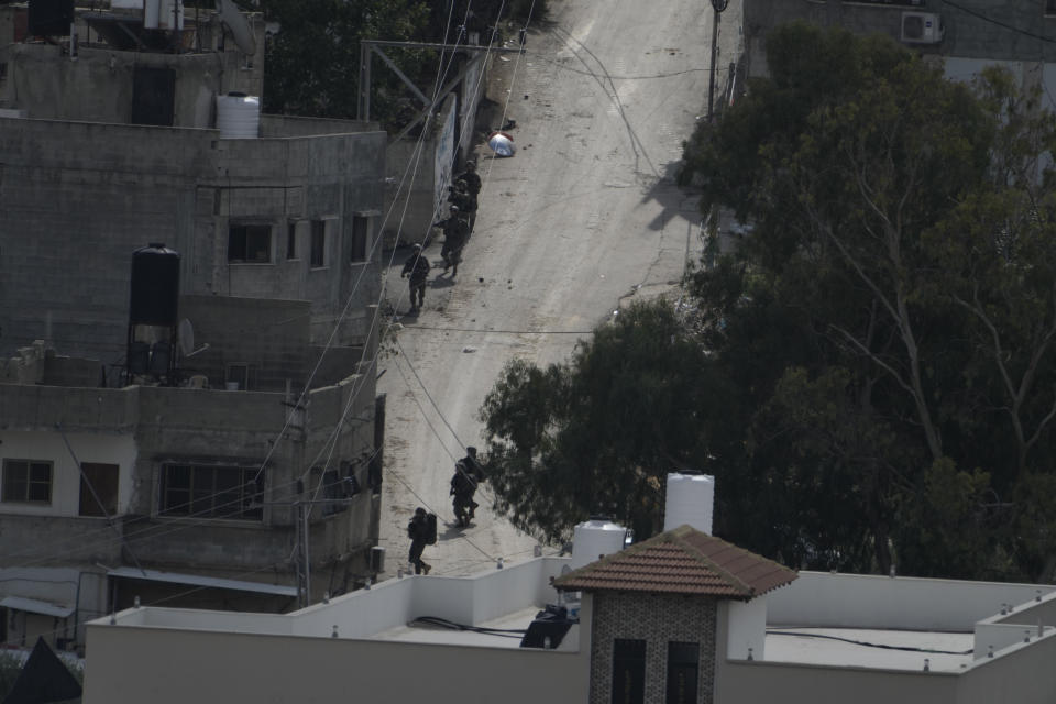 Israeli soldiers are seen during a raid on Nur Shams refugee camp in the West Bank on Thursday, Oct. 19, 2023. (AP Photo/Majdi Mohammed)