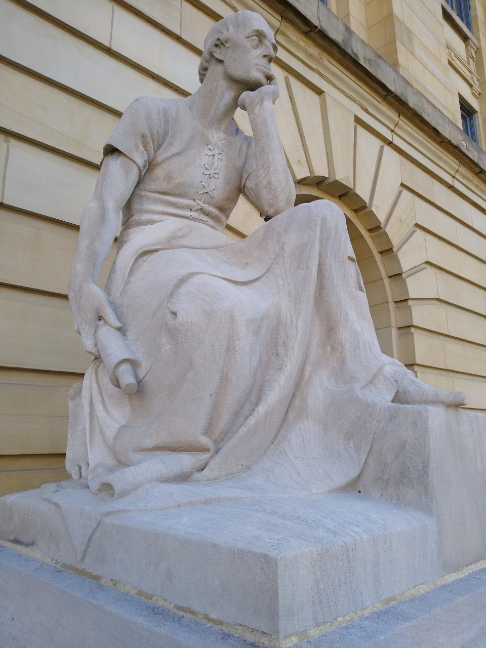 The limestone statue “Law,” carved by Herman N. Matzen, has been pondering legal matters since 1908 at the Summit County Courthouse in Akron.