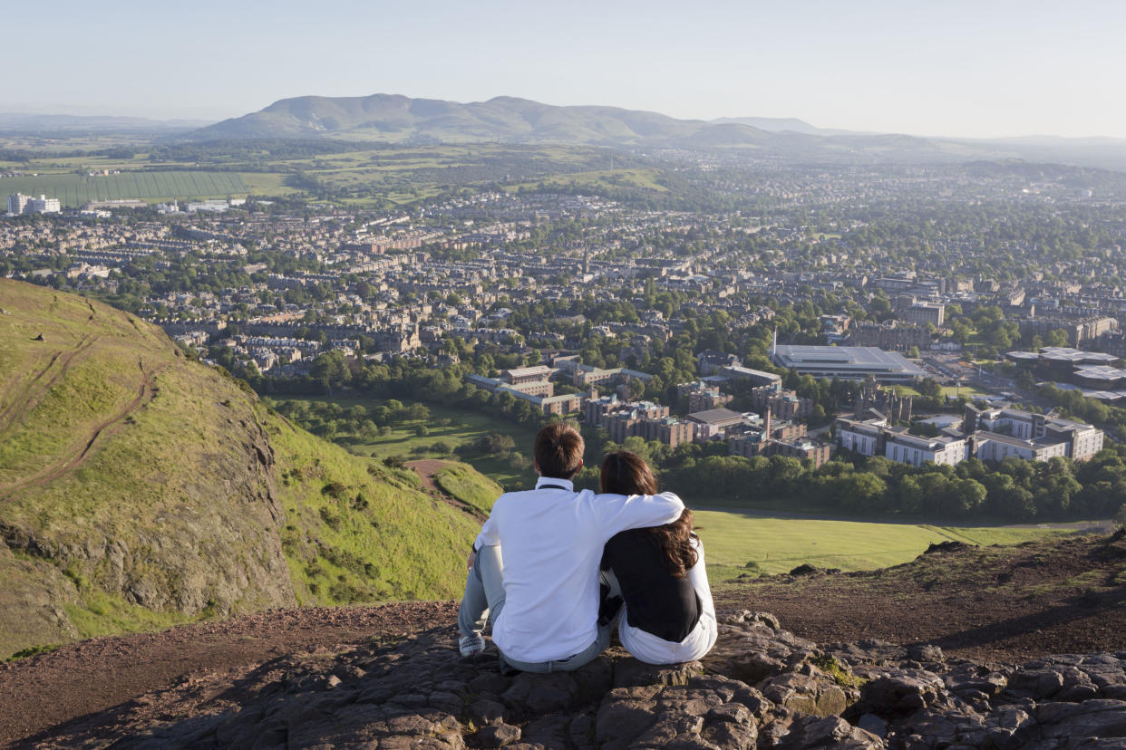 A couple enjoying the phenomenal view from Arthur's Seat (Getty Images)