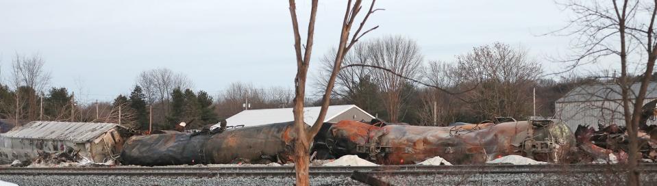 Train cars and tanks lie on their sides along the tracks after a derailment Feb. 3 in East Palestine, Ohio.