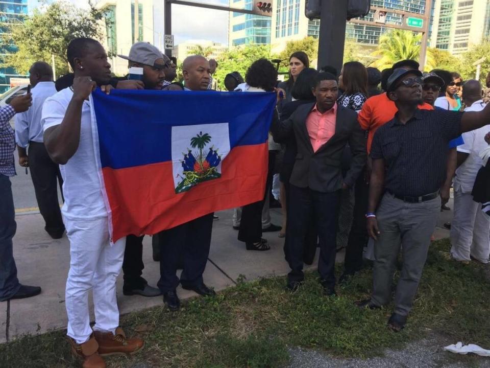 In January 2017, supporters of Haitian senator-elect Guy Philippe held up a Haitian flag outside the federal courthouse in Miami.