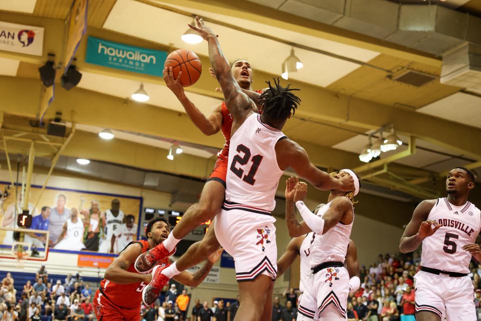 Texas Tech's Jaylon Tyson shoots over Louisville's Sydney Curry (21) during the Red Raiders' 70-38 victory on Nov. 22 at the Maui Jim Maui Invitational in Lahaina, Hawaii.