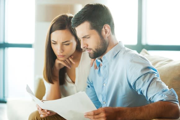 Young couple looking at papers