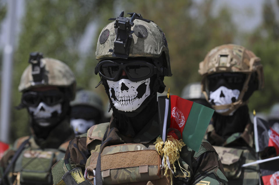 FILE - In this July 17, 2021 file photo, new Afghan Army Special Forces attend their graduation ceremony after a three-month training program at the Kabul Military Training Center, in Kabul, Afghanistan. In an interview with The Associated Press Thursday, July 22, 2021, Suhail Shaheen, Afghan Taliban spokesman and a member of the Taliban negotiation team, said the insurgent movement does not want to monopolize power, but there won't be peace until there is a new, negotiated government in Kabul and Afghan President Ashraf Ghani is removed. Shaheen said women will be allowed to work, go to school, and participate in politics but will have to wear the hijab, or headscarf. (AP Photo/Rahmat Gul)