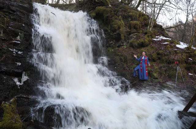 Minister at waterfall