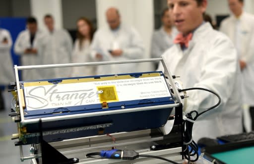 Chester Gillmore, SVP of manufacturing at Planet, introduces a satellite during a media tour at Planet's manufacturing facility in San Francisco, California on September 11, 2018