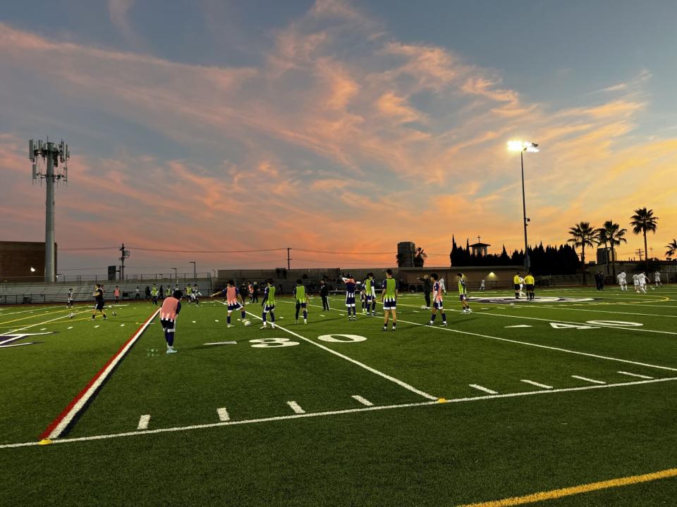 Cathedral High players warm up before taking on Loyola.