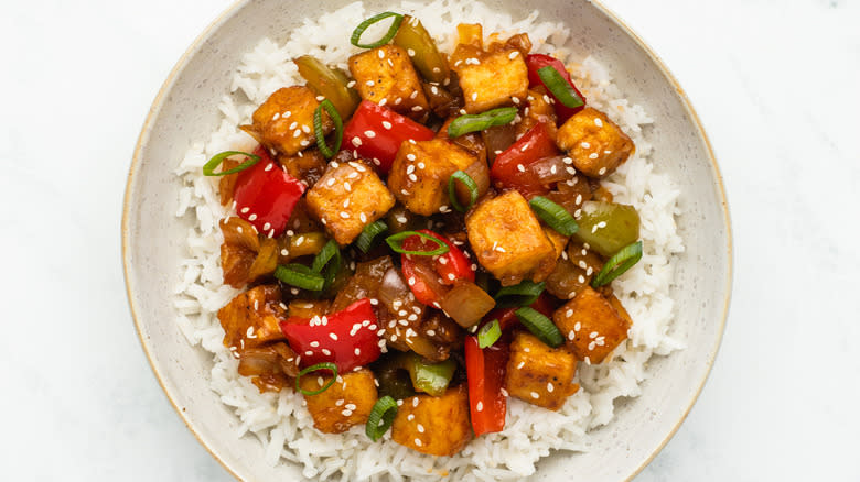 Kung pao tofu in bowl with rice