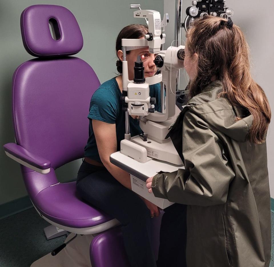 Charlotte Wiley "examines" Dr. Brigette Colley's eyes.