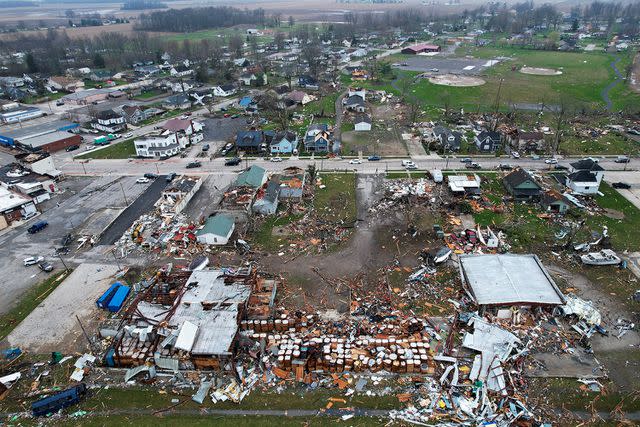 <p>AP Photo/Joshua A. Bickel</p> Debris scatters the ground following a severe storm Friday, March 15, 2024, in Lakeview, Ohio