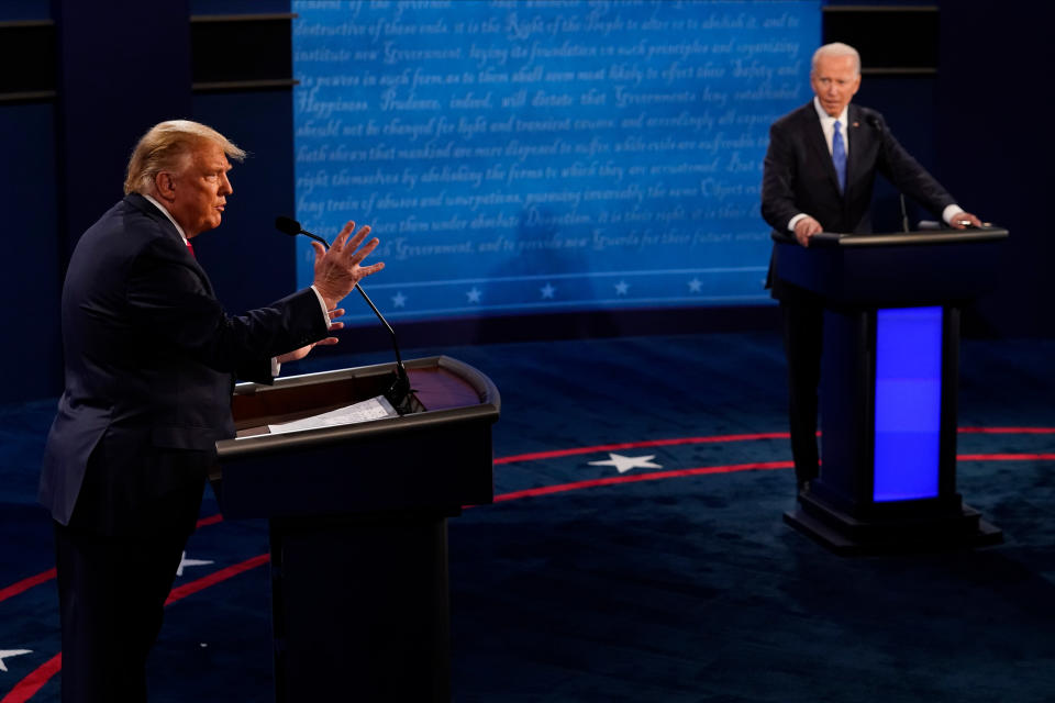President Donald Trump answers a question as Democratic presidential candidate former Vice President Joe Biden listens during the second and final presidential debate at Belmont University on Oct. 22. (Photo: Pool via Getty Images)