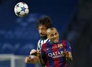 Barcelona's Dani Alves in action with Juventus' Andrea Pirlo. Reuters / Michael Dalder