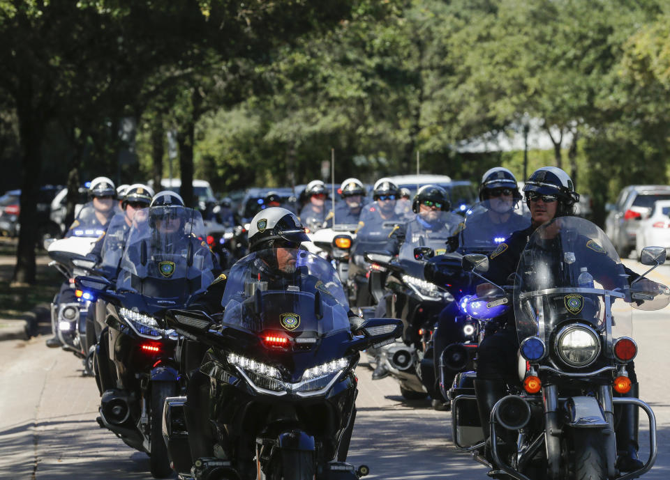 Houston Police officers escort the body of Sgt. Harold Preston from Memorial Hermann Hospital to the medical examiner's office, Tuesday, Oct. 20, 2020, in Houston. Two officers were shot by a suspect during a domestic violence call at an apartment complex Tuesday. The other officer Courtney Waller was shot in the arm and is in stable condition at a hospital. ( Godofredo A. Vásquez/Houston Chronicle via AP)