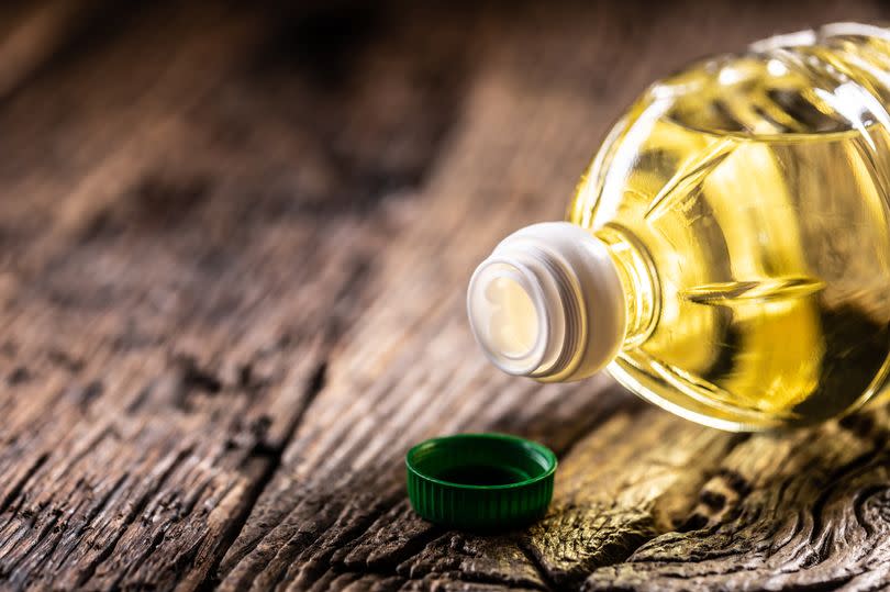 Olive, Sunflower or rapeseed oil in a plastic bottle, detail on the cap.