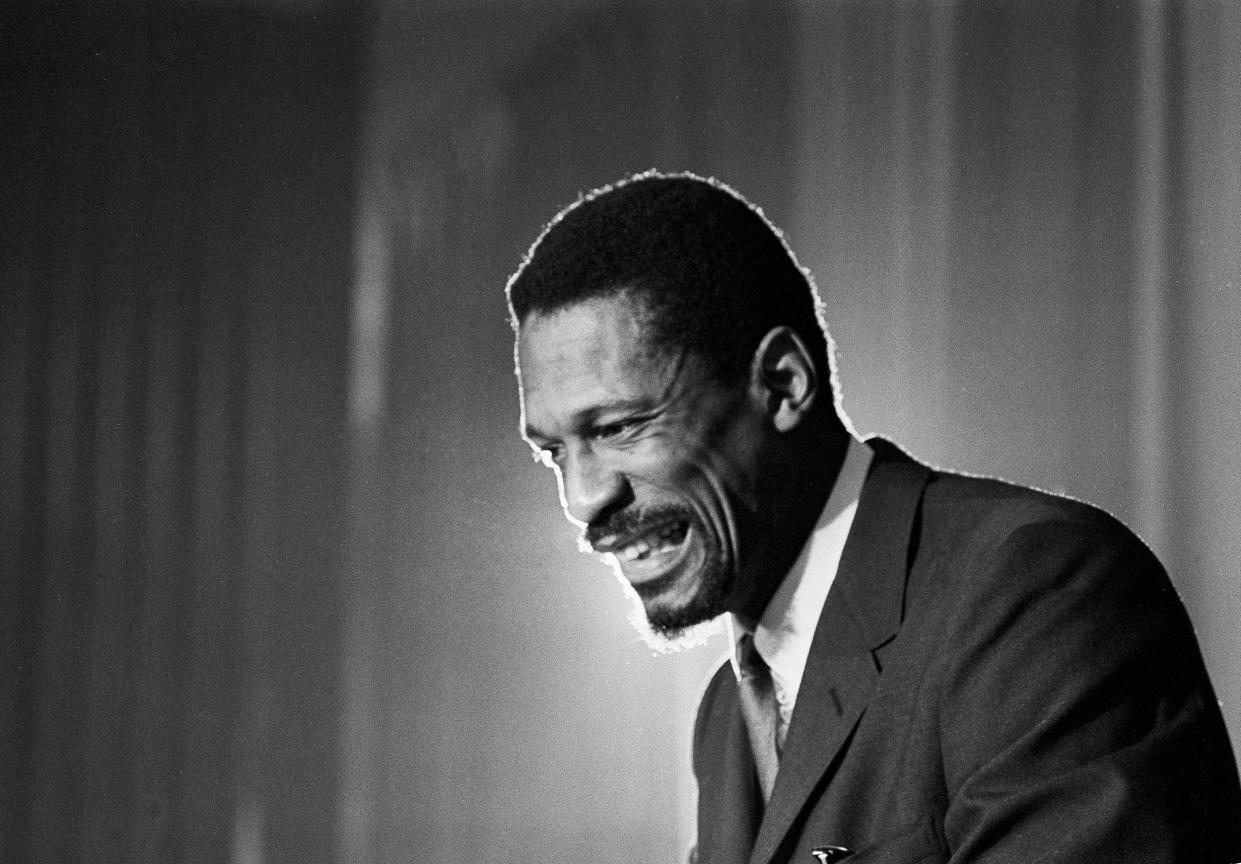 Bill Russell grins at announcement that he had been named coach of the Boston Celtics on April 18, 1966. (AP file)