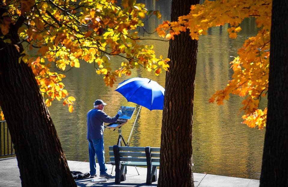 Taking advantage of the pleasant weather and turning leaves, Terry Rone tries to capture some of that magic on canvas as he spends the day painting at Henderson’s John James Audubon State Park Wednesday, Nov. 4, 2020.