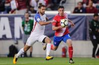 Sep 1, 2017; Harrison, NJ, USA; United States defender Graham Zusi (19) chases the ball against Costa Rica defender Bryan Oviedo (8) during the first half at Red Bull Arena. Vincent Carchietta-USA TODAY Sports