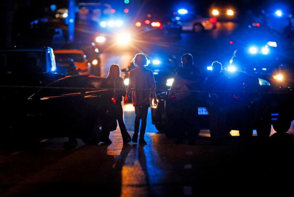 Police officers work an active shooter scene in Memphis, Tennessee on Wednesday night. Authorities said a man drove around the city shooting at people during an hours-long rampage that forced frightened people to shelter in place.