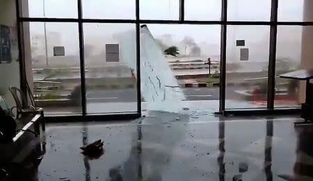 A glass door shatters during Cyclone Fani in Bhubaneswar, Odisha, India May 3, 2019 in this still image taken from a video obtained from social media. AMAN PRATAP SINGH/via REUTERS