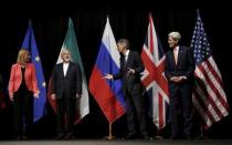 FILE PHOTO: British Foreign Secretary Philip Hammond (2nd R), U.S. Secretary of State John Kerry (R) and European Union High Representative for Foreign Affairs and Security Policy Federica Mogherini (L) talk to Iranian Foreign Minister Mohammad Javad Zarif as the wait for Russian Foreign Minister Sergey Lavrov (not pictured) for a group picture at the Vienna International Center in Vienna, Austria July 14, 2015. REUTERS/Carlos Barria/File Photo