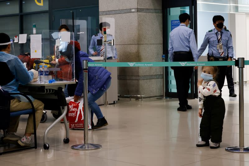 Passengers from overseas arrive at the Incheon International Airport, in Incheon