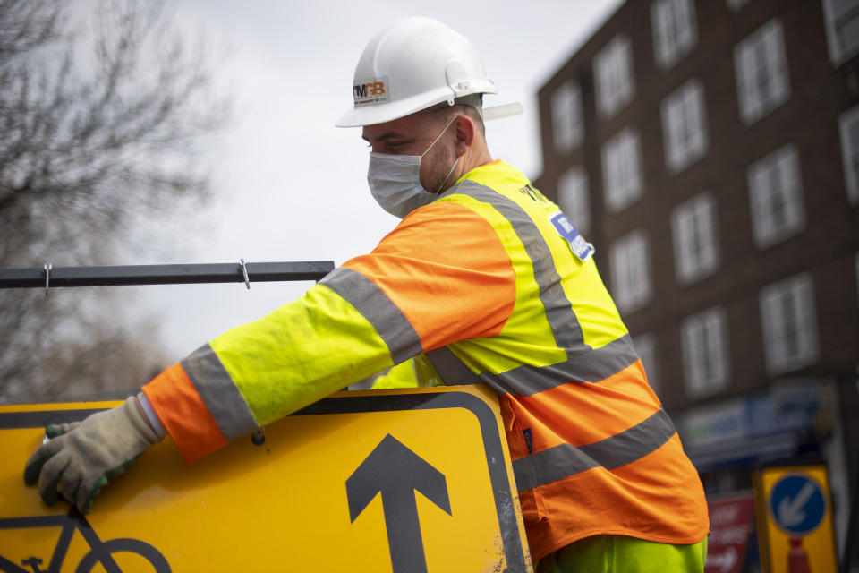 A construction worker wearing a protection face mask in Westminster, London as the UK continues in lockdown to help curb the spread of the coronavirus.