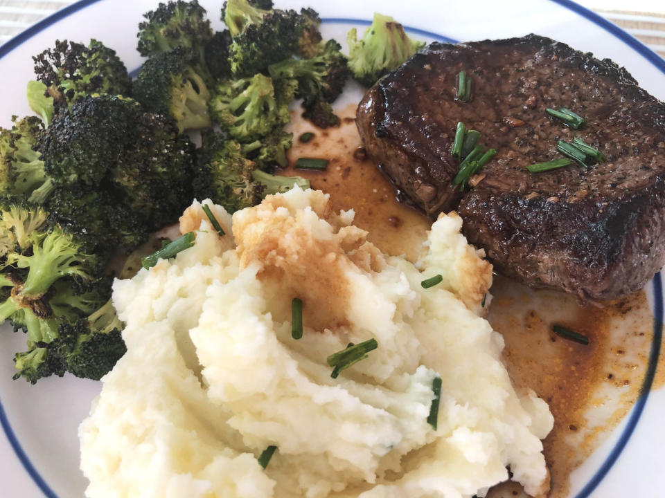 Steak, broccoli, and mashed potatoes on a plate