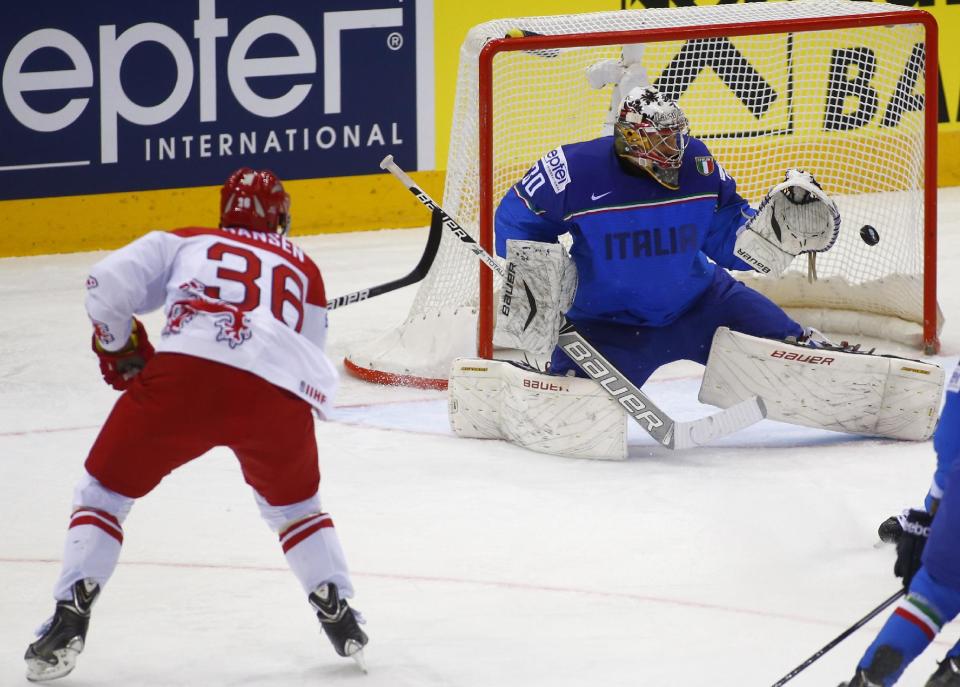 Denmark's Jannik Hansen, left, scores past Italy's Daniel Bellissimo during the Group A preliminary round match at the Ice Hockey World Championship in Minsk, Belarus, Tuesday, May 13, 2014. (AP Photo/Sergei Grits)