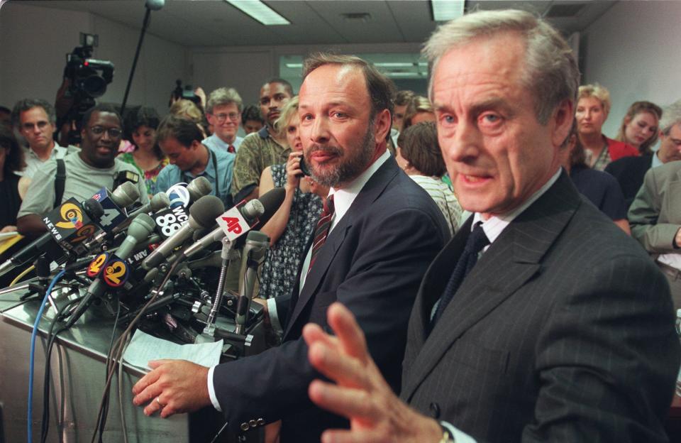 FILE - Author of "Primary Colors" Joe Klein, center, and Random House President Harry Evans hold a press briefing in New York, July 17, 1996. Klein, a Newsweek columnist, identified himself Wednesday as the author of the best-selling satire of the Clinton 1992 presidential campaign. (AP Photo/Bebeto Matthews, File)