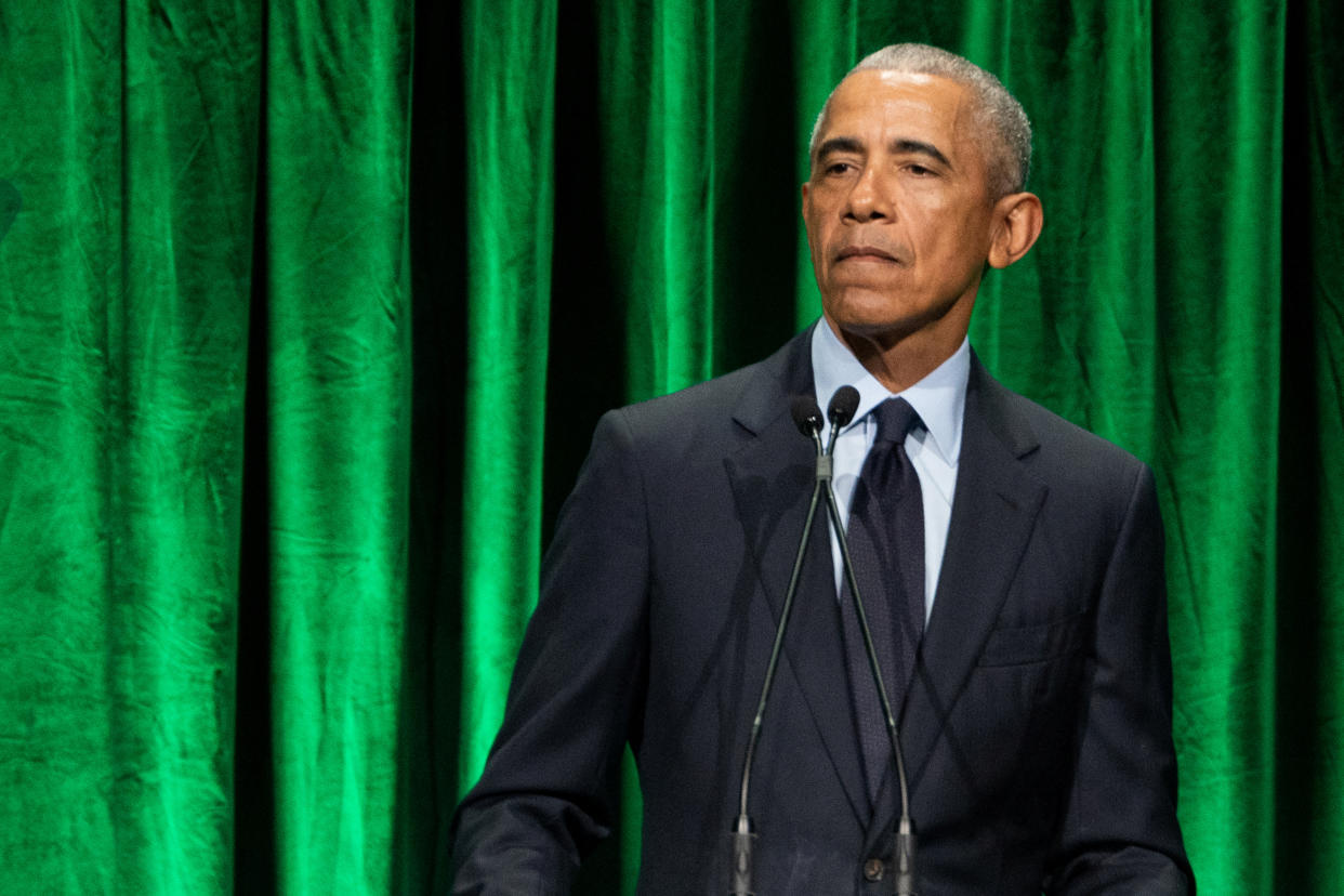 Former President Barack Obama pauses during a speech at a Sandy Hook Promise event.