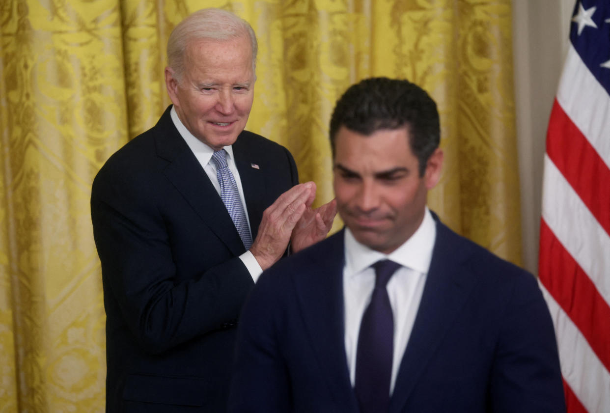 President Biden applauds after Suarez gave a speech in the East Room of the White House.