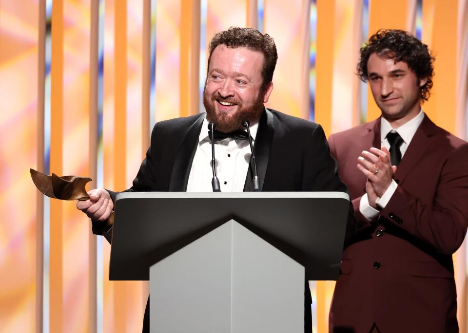 Neil Casey speaks onstage at the Writers Guild Awards West Coast on March 5 in Los Angeles, California. He was among a team of writers who won for "Baking It," a Peacock baking reality competition series hosted by Maya Rudolph and Amy Poehler.