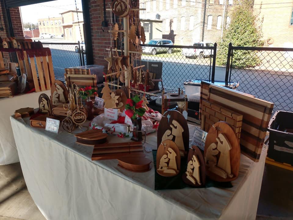 Pictured are handmade wooden Christmas ornaments and cutting blocks sold at the 2021 Harvest Market at the Lexington Farmers Market in November. Handmade items like these will be available at the 2021 Holiday Market on Dec. 4.