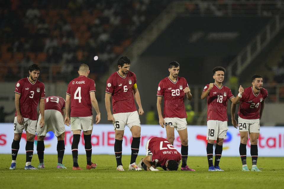 Egypt players watch the penalty shootout during the African Cup of Nations Round of 16 soccer match between Egypt and DR Congo, at the Laurent Pokou stadium in San Pedro, Ivory Coast, Sunday, Jan. 28, 2024. 2024. (AP Photo/Sunday Alamba)