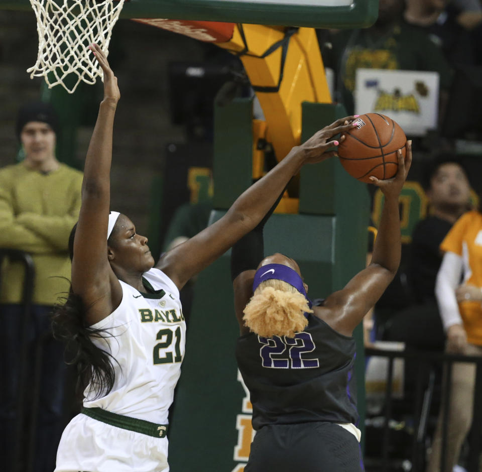 Baylor center Kalani Brown, left, blocks the shot of TCU center Jordan Moore, right in the second half of an NCAA college basketball game, Saturday, Feb. 9, 2019, in Waco, Texas. Baylor won 89-71. (AP Photo/Rod Aydelotte)