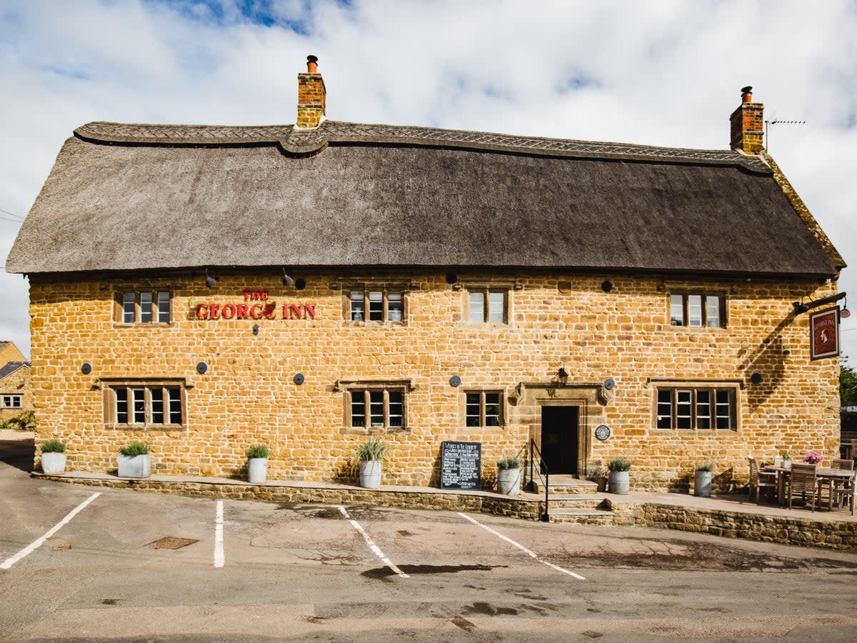This traditional thatched building houses nine comfortable rooms (The George Inn)