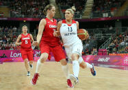 LONDON, ENGLAND - JULY 30: Johannah Leedham #13 of Great Britain drives with the ball past Courtnay Pilypaitis #7 of Canada during the Women's Basketball Preliminary Round match on Day 3 at Basketball Arena on July 30, 2012 in London, England. (Photo by Christian Petersen/Getty Images)