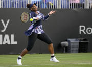 Serena Williams of the United States returns the ball during their doubles tennis match with Ons Jabeur of Tunisia against Marie Bouzkova of Czech Republic and Sara Sorribes Tormo of Spain at the Eastbourne International tennis tournament in Eastbourne, England, Tuesday, June 21, 2022. (AP Photo/Kirsty Wigglesworth)