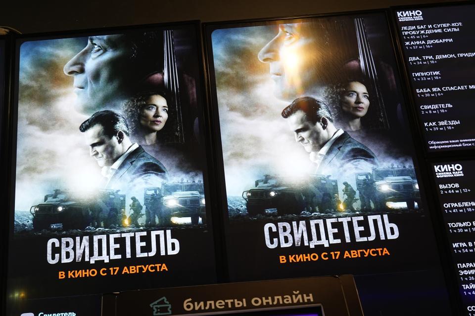 A ticket machine with a poster of "The Witness" movie is displayed in a cinema lobby inside a shopping mall in Moscow, Russia, Thursday, Aug. 17, 2023. "The Witness," a state-sponsored drama that premiered in Russia on Aug. 17, is the first feature film about Russia's military campaign in Ukraine to hit the movie theaters nationwide. It depicts Ukrainian troops as violent neo-Nazis who torture and kill their own people. (AP Photo/Alexander Zemlianichenko)