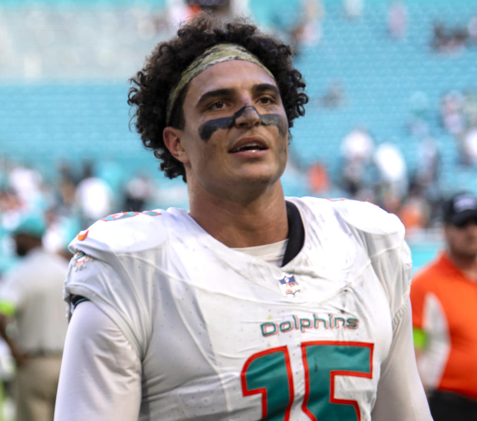 FILE - Miami Dolphins linebacker Jaelan Phillips walks off of the field after playing the Las Vegas Raiders, Nov. 19, 2023, in Miami Gardens, Fla. The Dolphins exercised the fifth-year options for Phillips and wide receiver Jaylen Waddle, the team announced Monday, April 29, 2024. (AP Photo/Michael Laughlin)