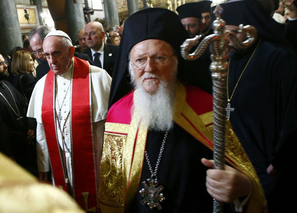 Pope Francis and Ecumenical Patriarch Bartholomew I of Constantinople (R) leave after an Ecumenical Prayer in the Patriarchal Church of Saint George in Istanbul November 29, 2014. Pope Francis began a visit to Turkey on Friday with the delicate mission of strengthening ties with Muslim leaders while condemning violence against Christians and other minorities in the Middle East. (REUTERS/Tony Gentile)