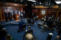 Sen. Tim Scott, R-S.C., center, accompanied by from left, Rep. Pete Stauber, R-Minn., Sen. James Lankford, R-Okla., Senate Majority Leader Mitch McConnell of Ky., Sen. John Cornyn, R-Texas, Sen. Shelley Moore Capito, R-W.Va., Sen. Lindsey Graham, R-S.C., and Sen. Ben Sasse, R-Neb., speaks at a news conference to announce a Republican police reform bill on Capitol Hill, Wednesday, June 17, 2020, in Washington. (AP Photo/Andrew Harnik)