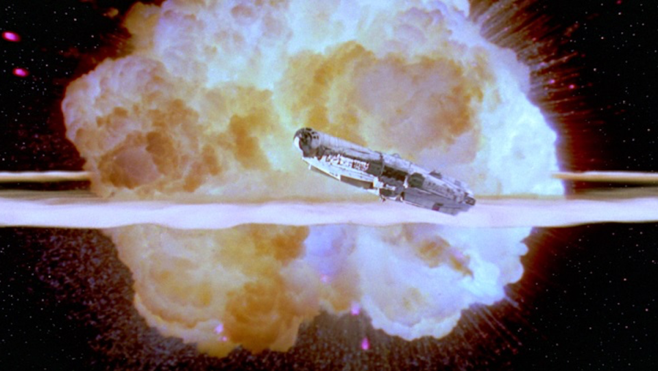 The Millennium Falcon flies away from the exploding Death Star.