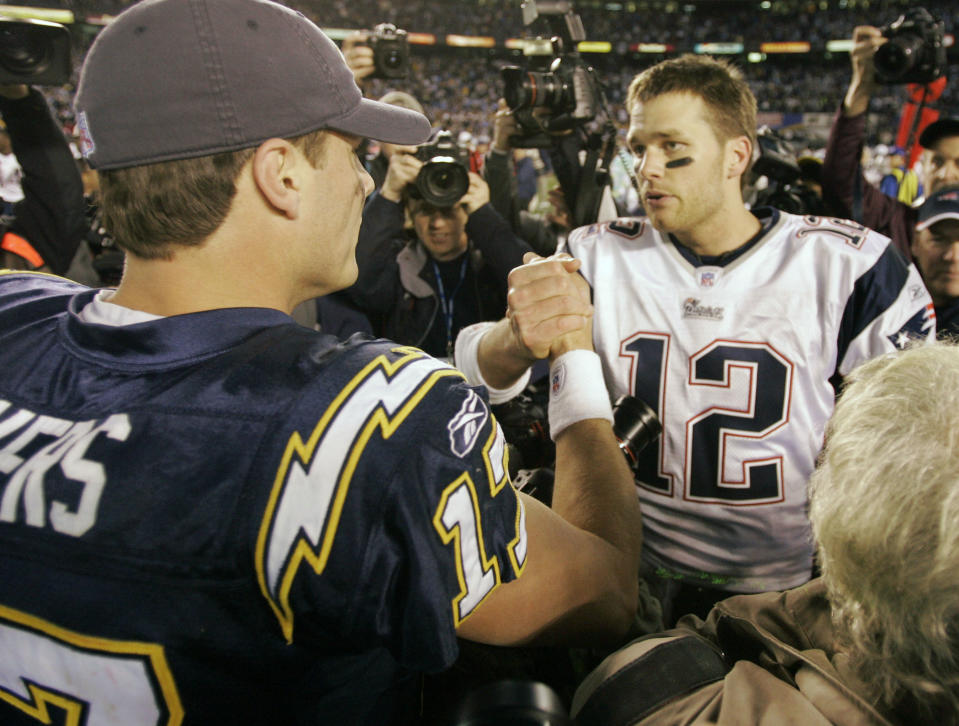 San Diego Chargers quarterback Philip Rivers, left, shakes hands with New England Patriots quarterback Tom Brady following their playoff game at the end of the 2006 season. (AP Photo/Mark J. Terrill)