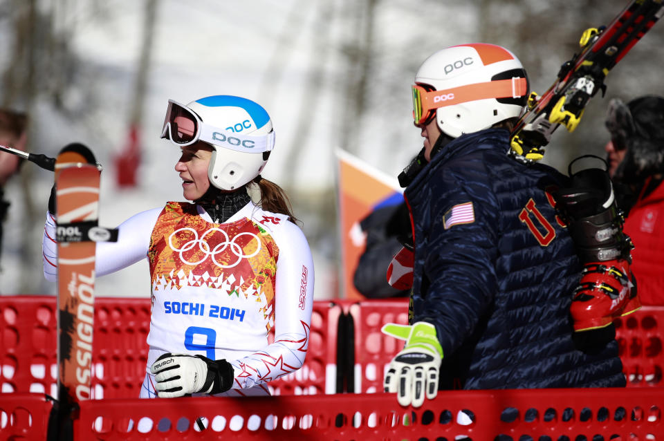 United States' Julia Mancuso talks to a teammate in the finish area after a women's downhill training run for the 2014 Winter Olympics, Thursday, Feb. 6, 2014, in Krasnaya Polyana, Russia. (AP Photo/Gero Breloer)