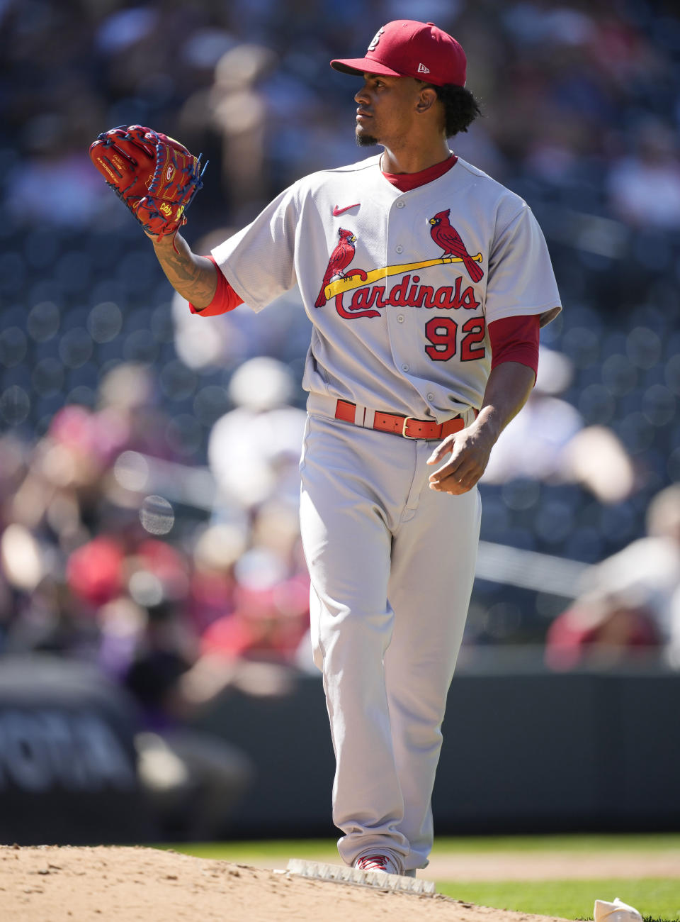 St. Louis Cardinals relief pitcher Genesis Cabrera calls for a new ball after giving up a solo home run to Colorado Rockies' Ryan McMahon in the seventh inning of a baseball game Thursday, Aug. 11, 2022, in Denver. (AP Photo/David Zalubowski)