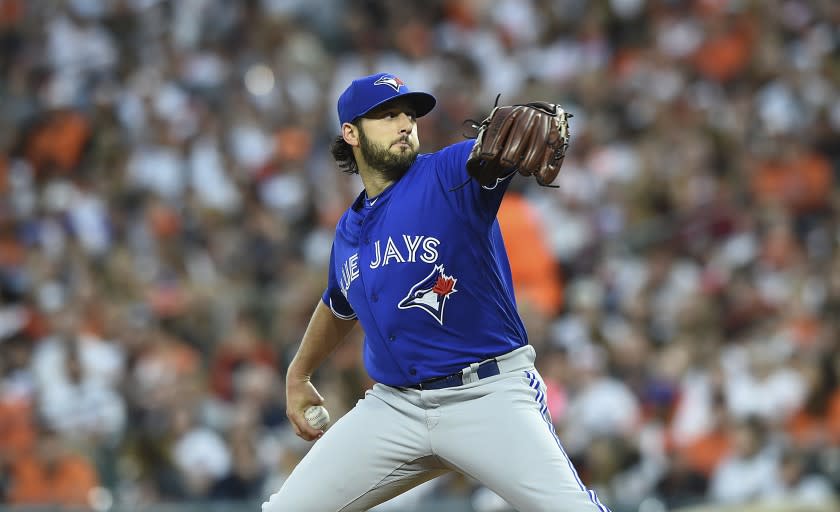 Toronto Blue Jays starting pitcher Mike Bolsinger delivers against the Baltimore Orioles.