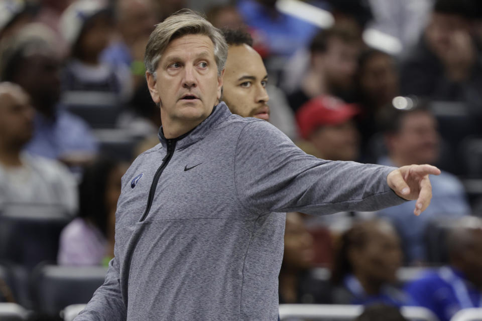 Minnesota Timberwolves coach Chris Finch points gestures during the first half of the team's NBA basketball game against the Orlando Magic, Wednesday, Nov. 16, 2022, in Orlando, Fla. (AP Photo/Kevin Kolczynski)